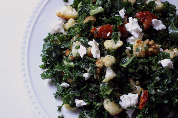 winter kale salad with roasted cauliflower, tomatoes, walnuts, and goat cheese.