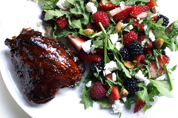 pomegranate molasses-glazed chicken thighs + tangled arugula and summer berry salad.