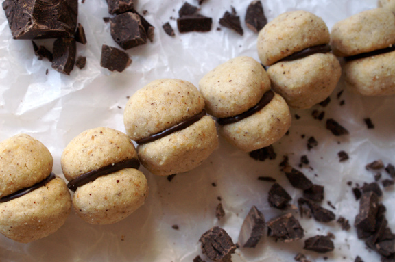 baci di dama [chocolate-filled hazelnut cookies].